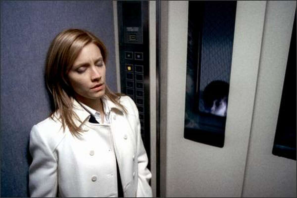 KaDee Strickland (left) and Yuya Ozeki in a scene from "The Grudge," based on the Japanese blockbuster "Ju-On: The Grudge." The normal façade of a modest house in Tokyo belies the hidden terror within. It is possessed by a violent plague that destroys the lives of everyone who enters.