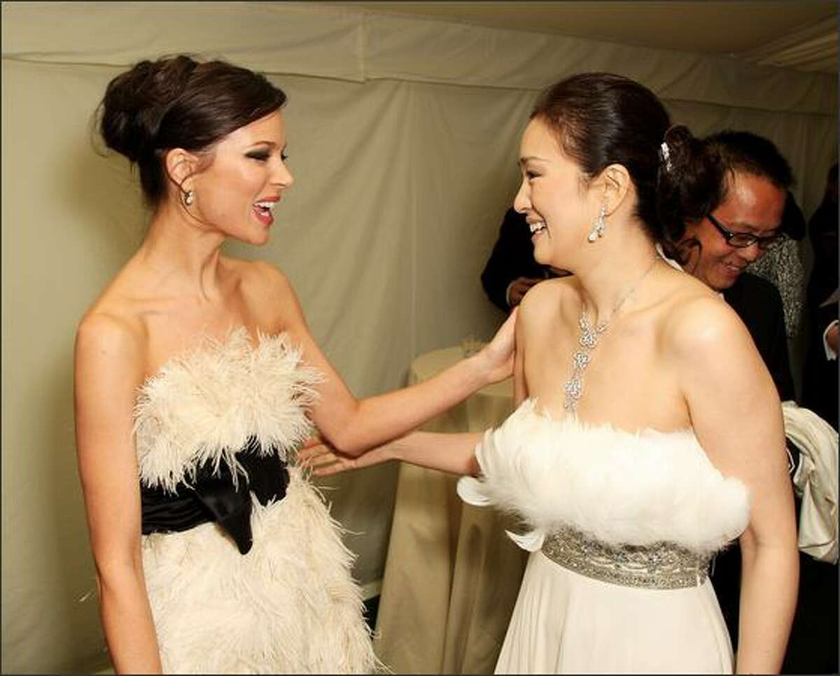 Designer Georgina Chapman (L) and actress Gong Li arrive at the Britain's Best 2008 awards at London Television Studios in London, England. The award ceremony honours outstanding Britons in categories including business, art, television, music, film, sport and fashion.