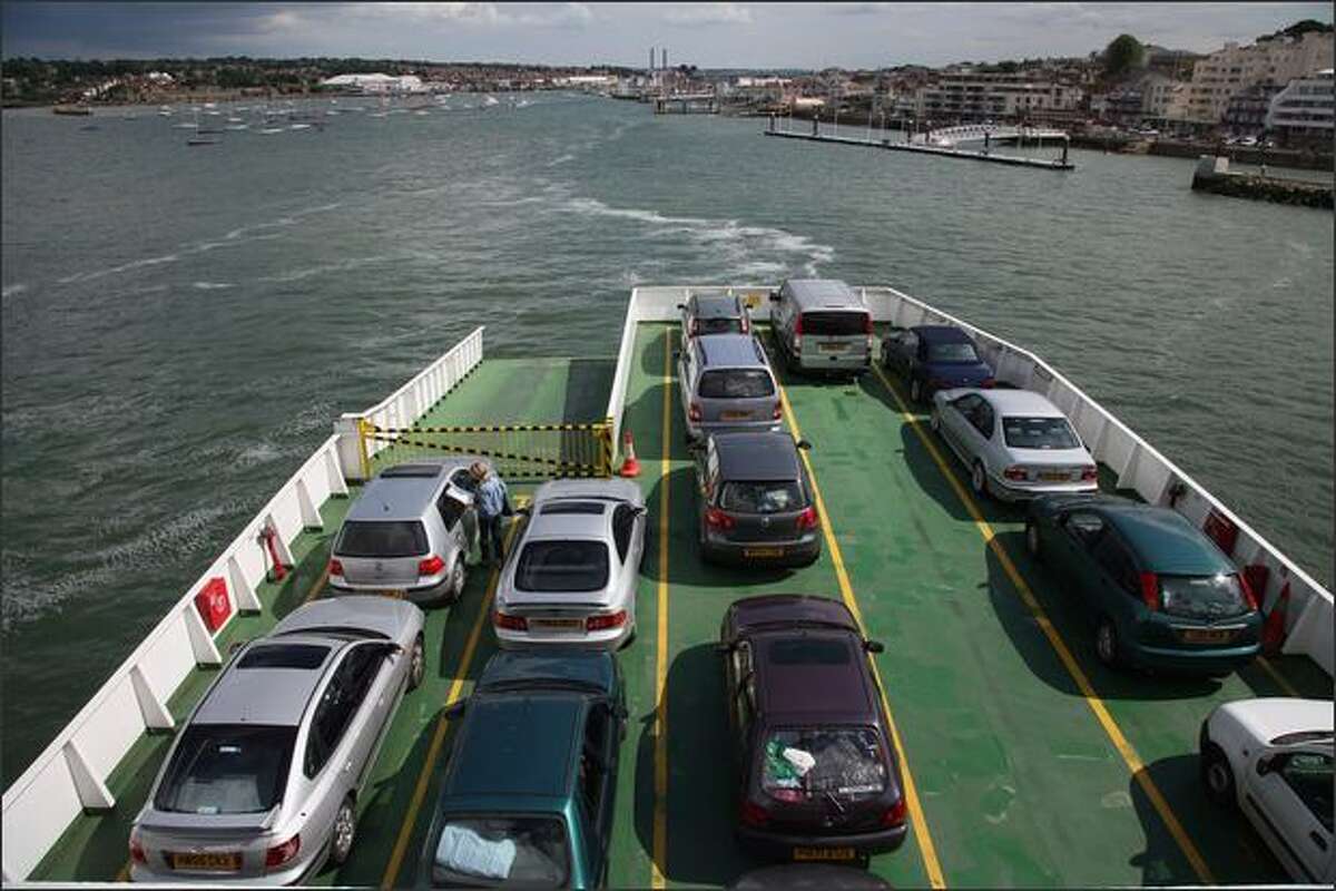 Some of the 50,000 music fans due to attend the Isle of Wight Festival arrive off the ferry at Cowes, in the Isle of Wight, England.