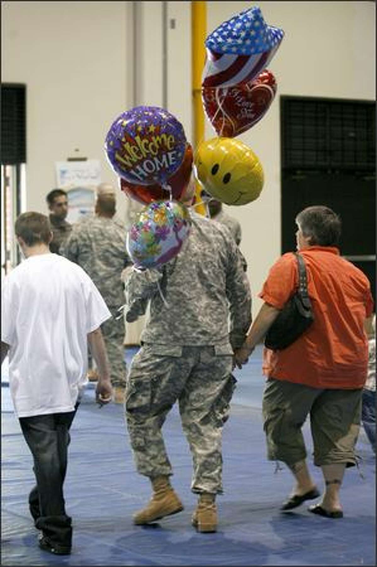 A soldier leaves Fort Lewis after being welcomed home from Iraq.