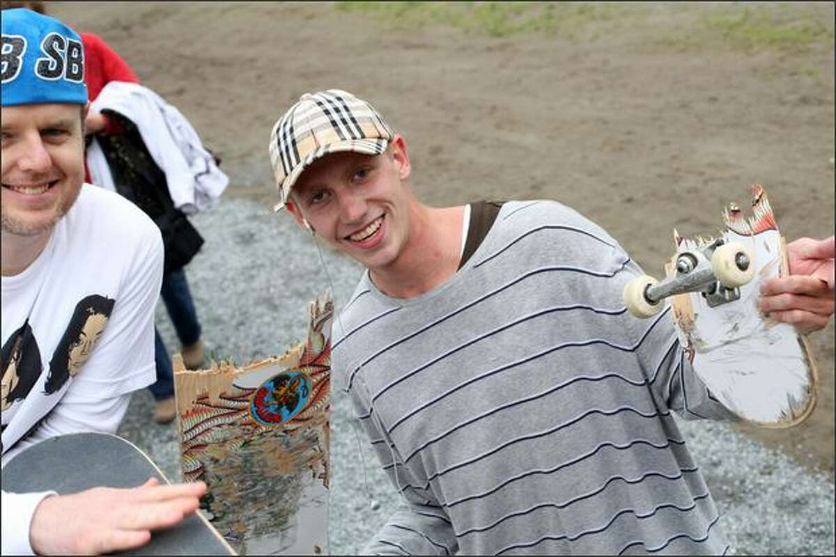 Peyton Dyer from Sammamish is still smiling after he snapped his skateboard in half during a contest during the opening of Lower Woodland Skateboard Park.