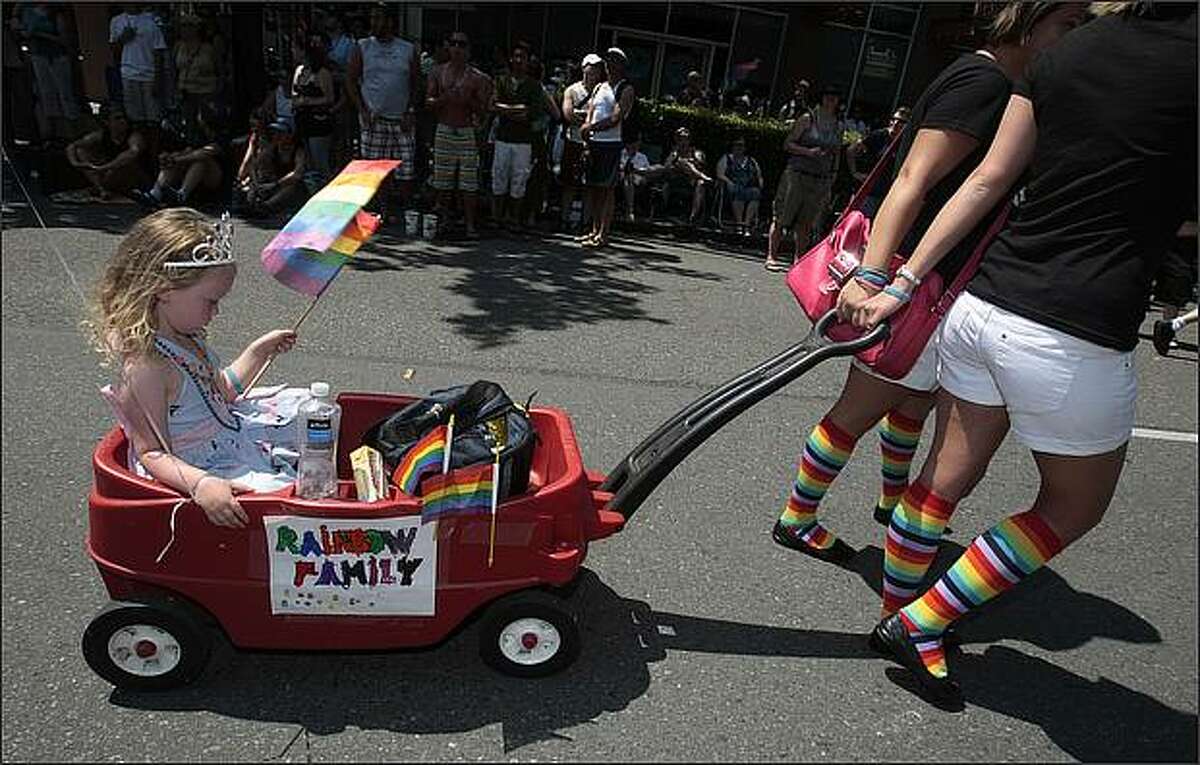 Tori Balsam-Ashling, 4, of Seattle, participates in the Gay Pride Parade with members of the Rainbow Families of Puget Sound.