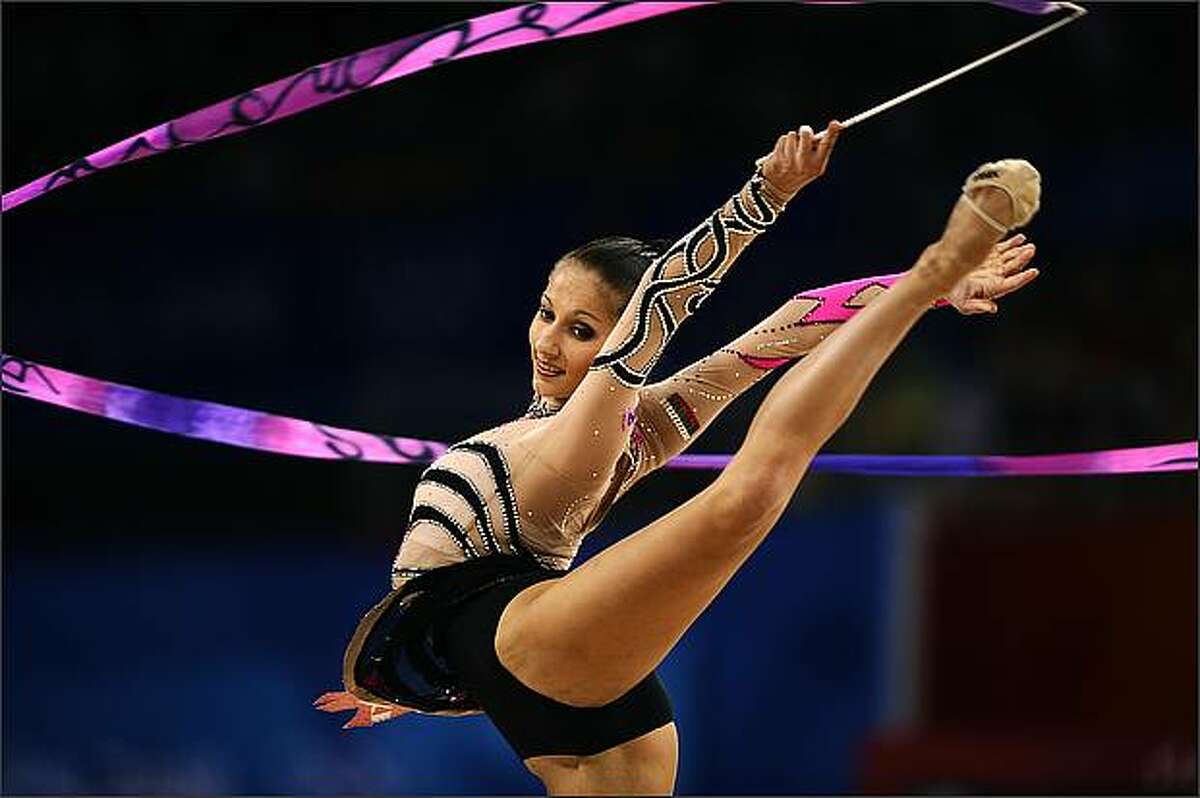 Bulgaria's Simona Peycheva competes in the individual all-around qualification of the rhythmic gymnastics at the Beijing 2008 Olympic Games in Beijing.