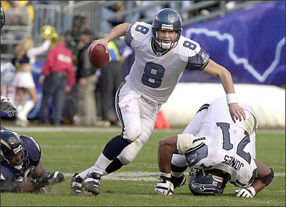 Matt Hasselbeck scrambles for a first down behind the blocking of Seahawks left tackle Walter Jones. Hasselbeck passed for a team record 449 yards against the Chargers.
