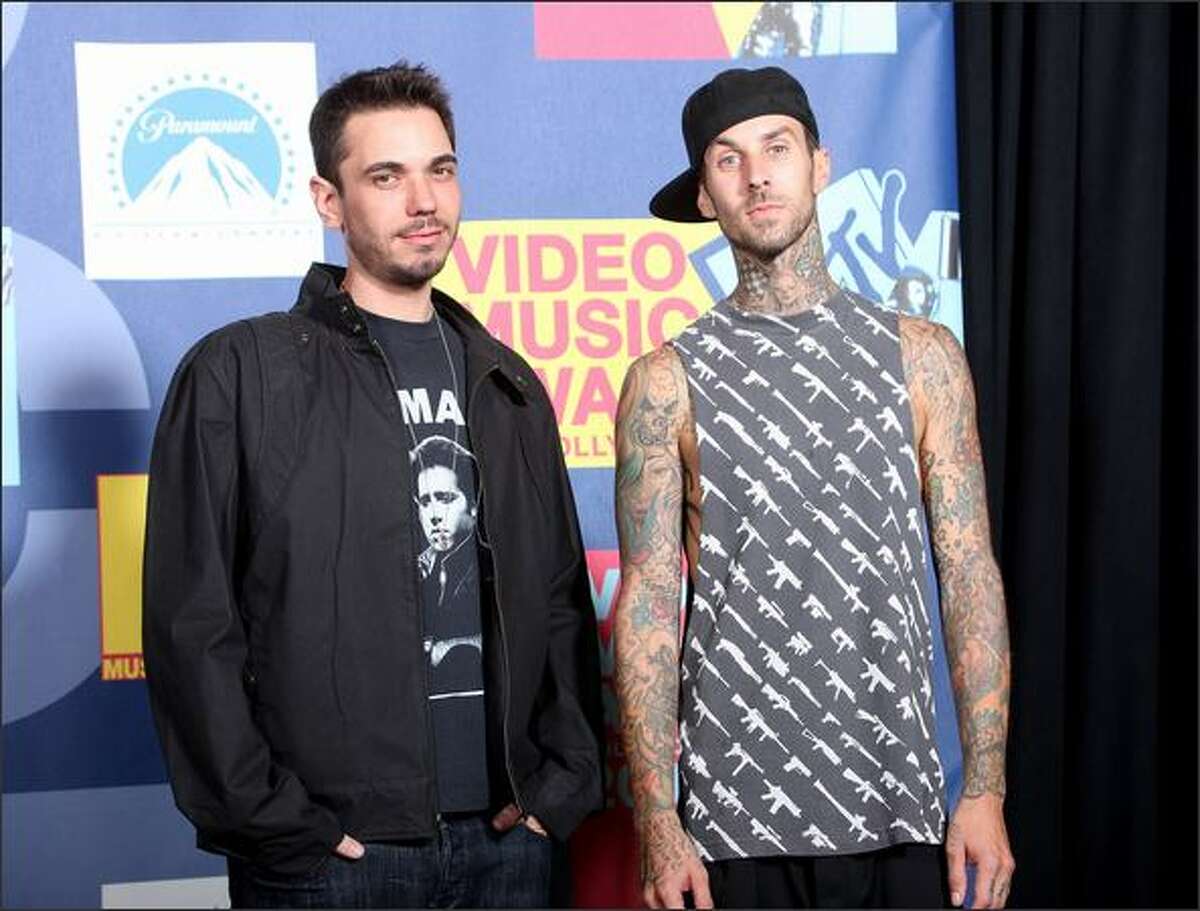 DJ AM (L) and musician Travis Barker poses in the press room at the 2008 MTV Video Music Awards at Paramount Pictures Studios on Sunday in Los Angeles, Calif.