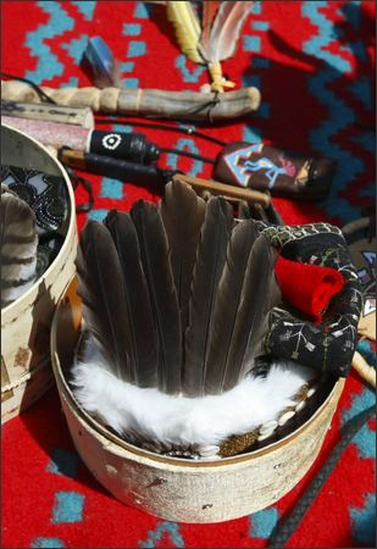 A crown of feathers and other items wait to be donned prior to the grand entry at the 2008 Seafair Indian Days Pow-Wow in in Seattle Saturday, July 18, 2008.