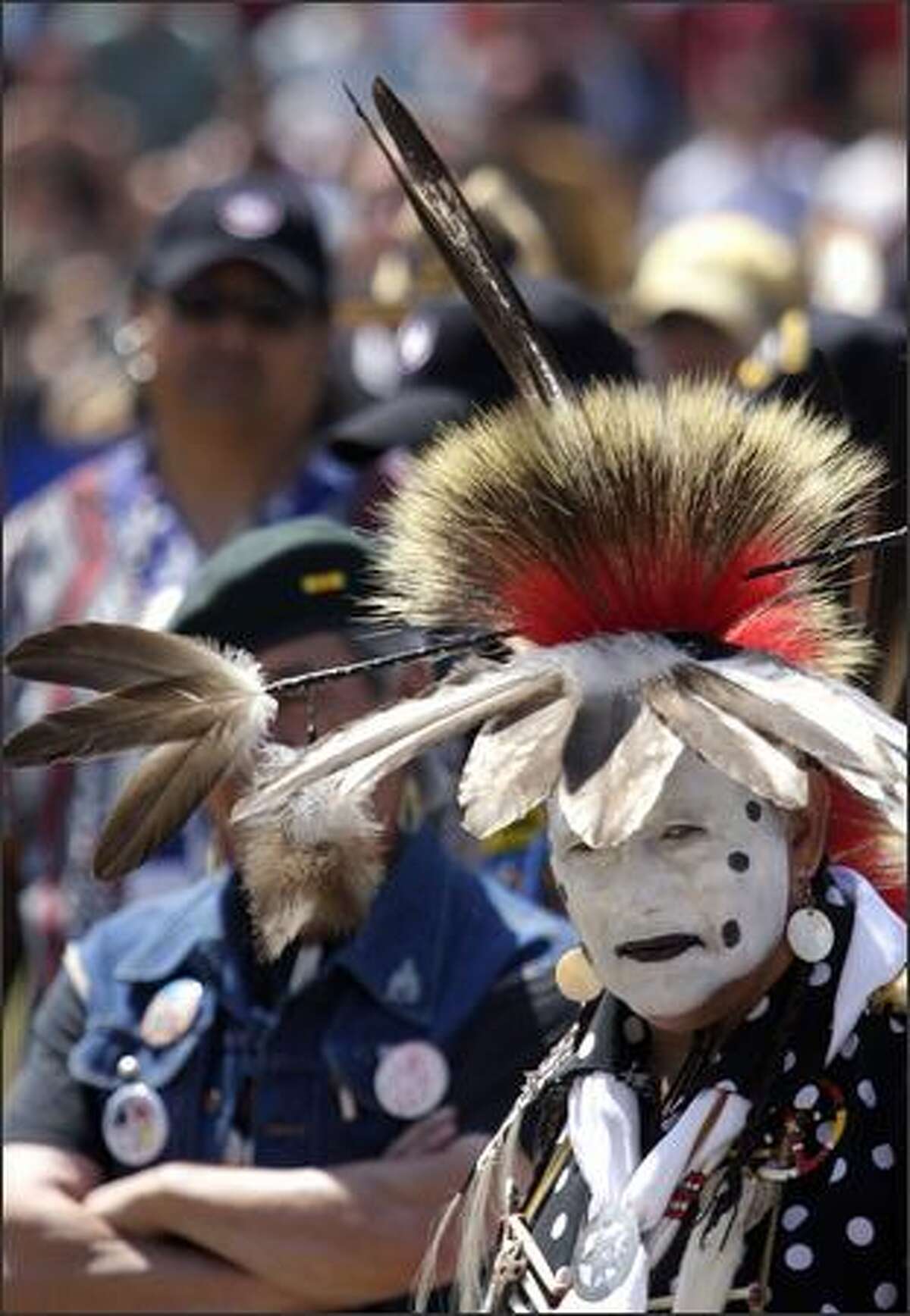 Mickey Mason, of the Caddo Nation, from Binger, Okla. stands with other military veterans as they are honored during the 2008 Seafair Indian Days Pow-Wow in in Seattle Saturday, July 18, 2008.