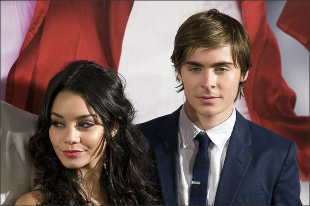 Actors Zac Efron and Vanessa Anne Hudgens pose prior to the screening of the film "High School Musical 3: Senior Year" on Thursday in Madrid.