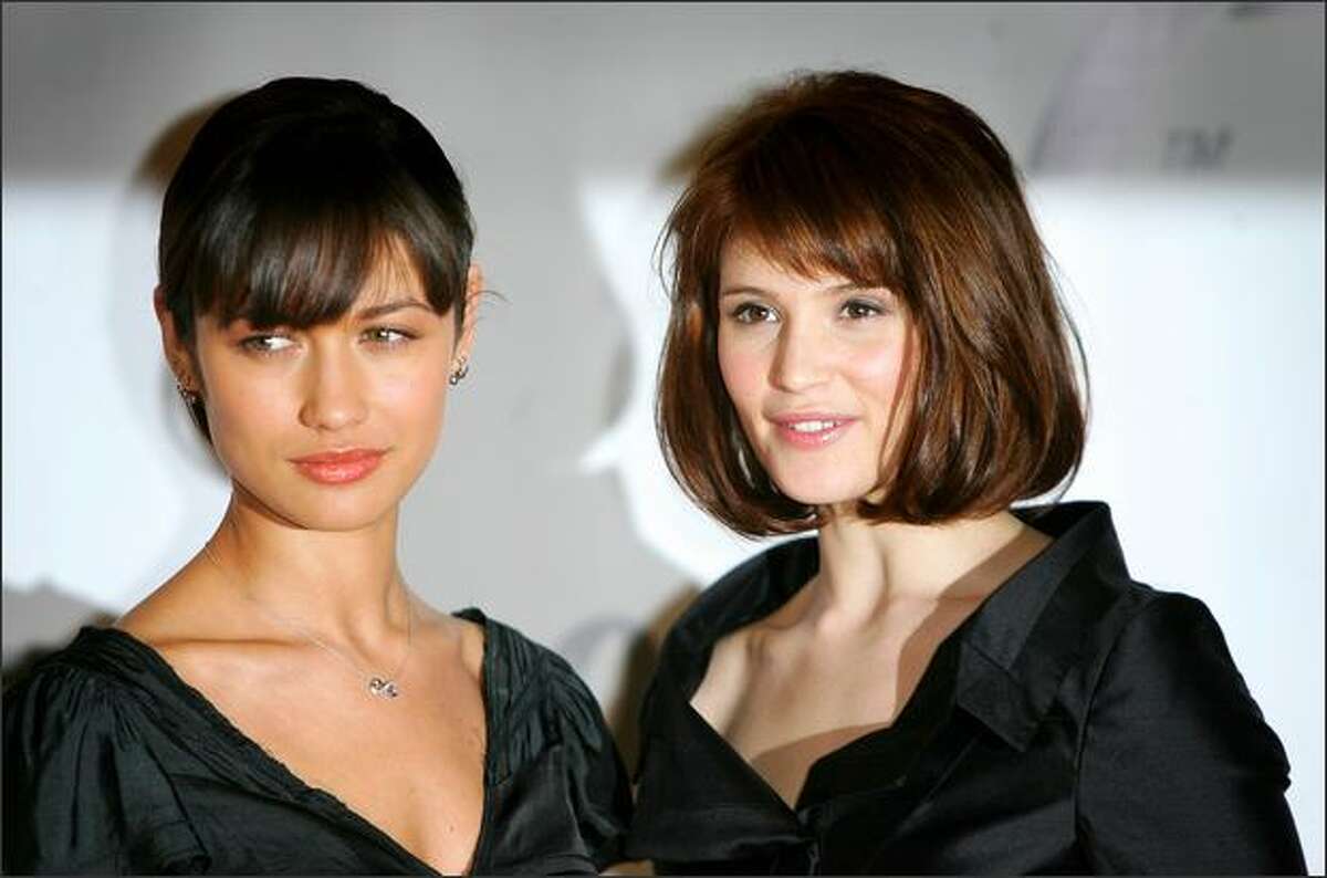 Actresses Olga Kurylenko (L) and Gemma Arterton attend a photocall to celebrate the start of production of the 22nd James Bond film 'Quantum of Solace' at Pinewood Studios on Jan. 24 near London, England.