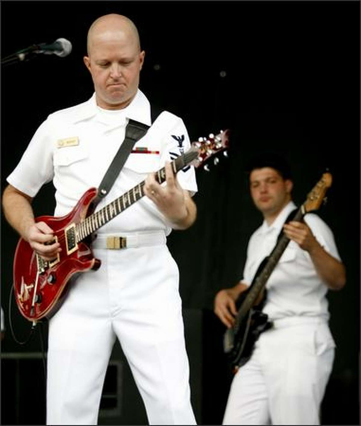 Members of the Navy rock band South by Northwest play a riff at Seafair on Saturday. (Kristine Paulsen/P-I)
