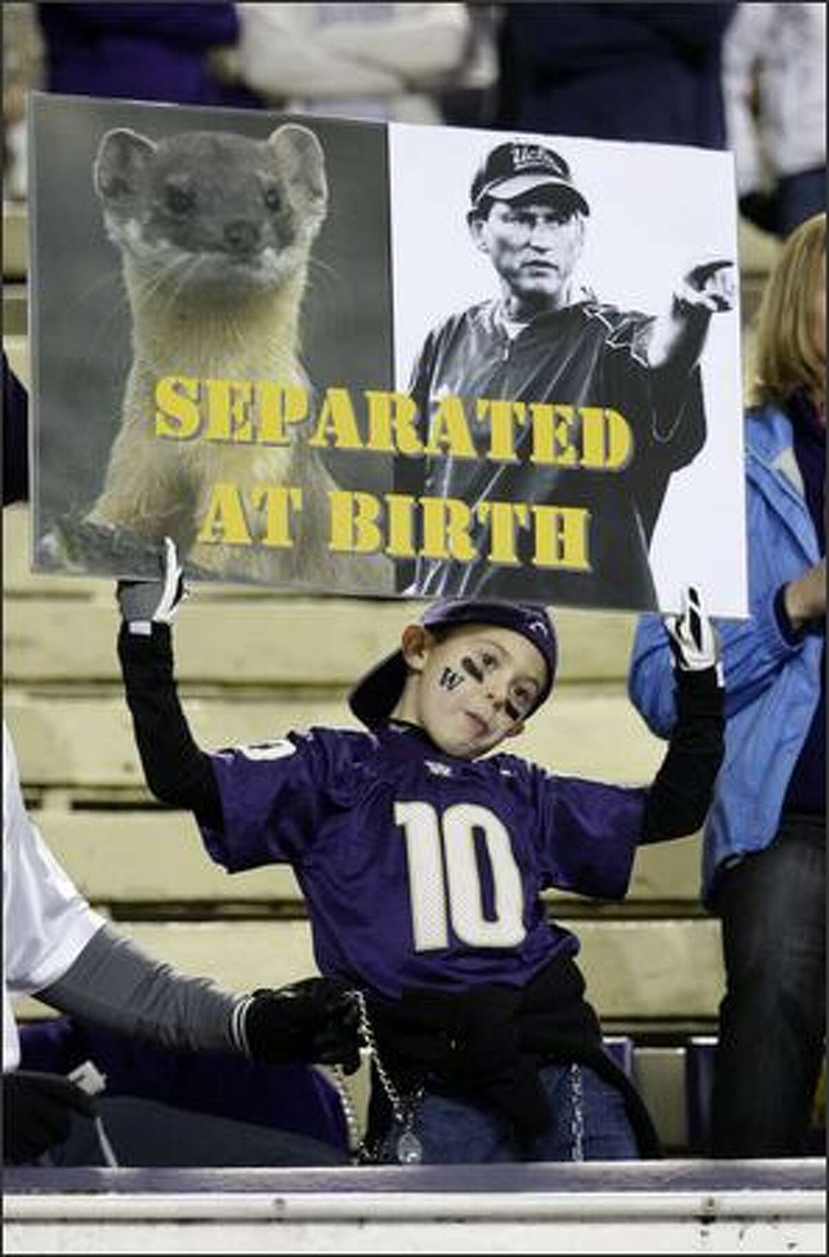 A Washington fan displays his distaste for UCLA head coach and former Washington coach Rick Neuheisel prior to the start of the game at Husky Stadium in Seattle on Saturday.