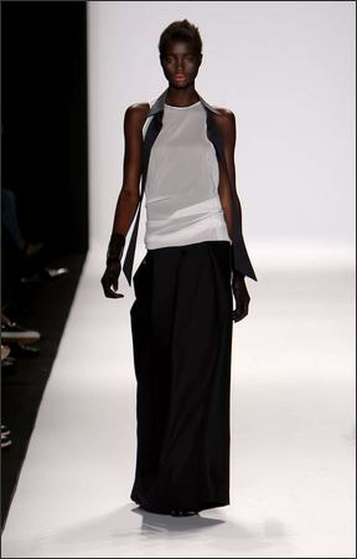A model walks the runway at the Academy of Art University show.