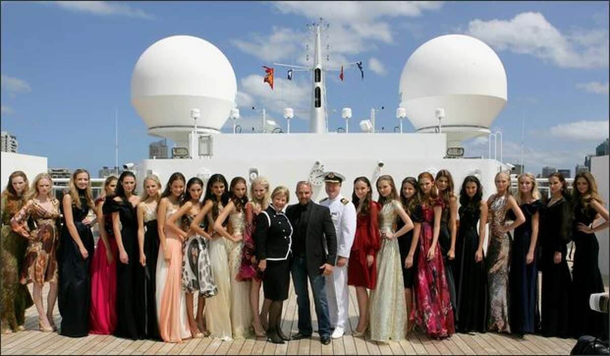 Alex Perry with models and Queen Mary 2 Hotel Manager on the Queen Mary 2 on Thursday in Sydney, Australia.