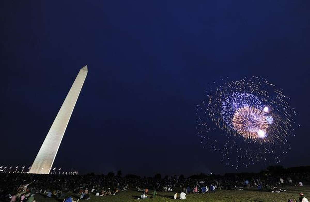 People watch fireworks at the National Mall.