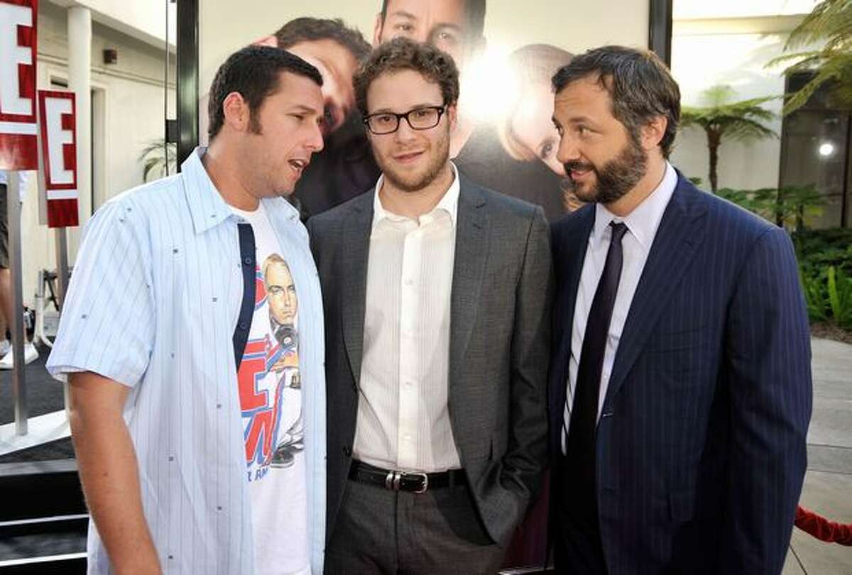 (L-R) Actor/executive producer Adam Sandler, actor Seth Rogen and director/writer/producer Judd Apatow attend the premiere of Universal Pictures' "Funny People" held at ArcLight Cinemas Cinerama Dome in Hollywood, California.