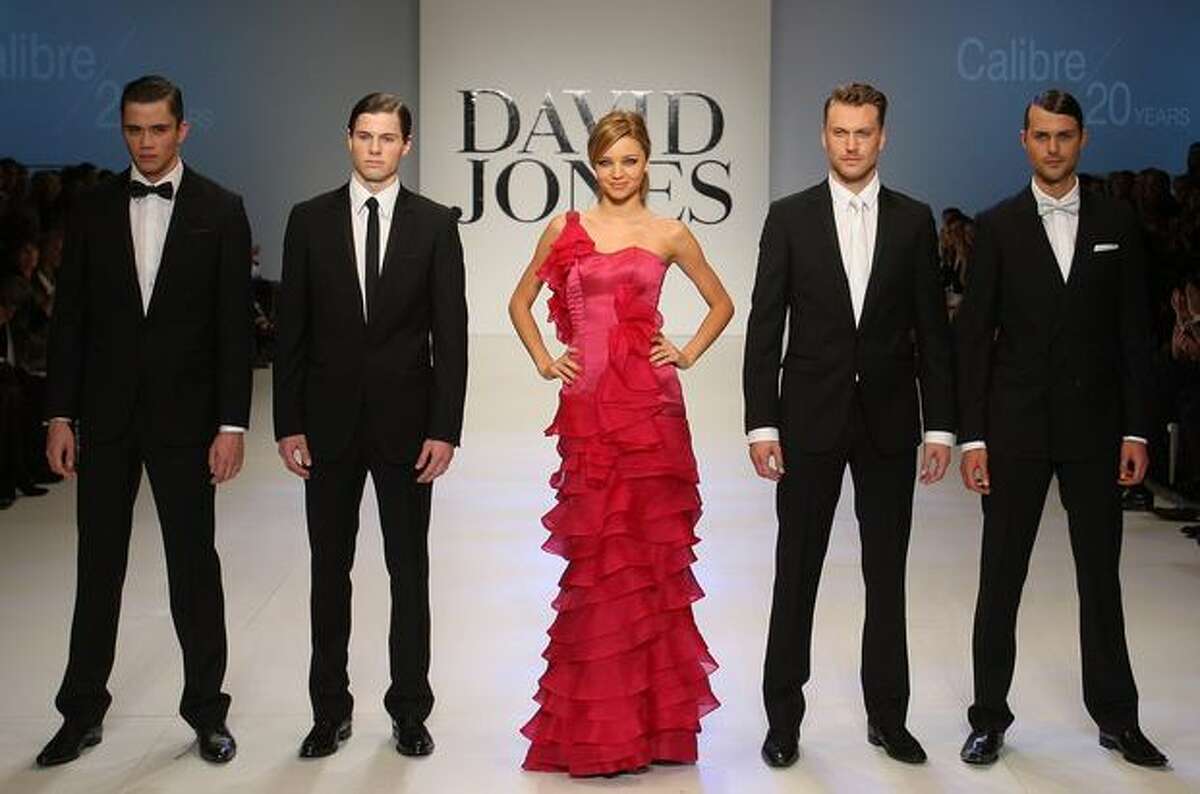 Model Miranda Kerr showcases designs by Alex Perry and the male models showcase Calibre on the catwalk at the David Jones Spring/Summer 2009 Season Launch in Melbourne, Australia