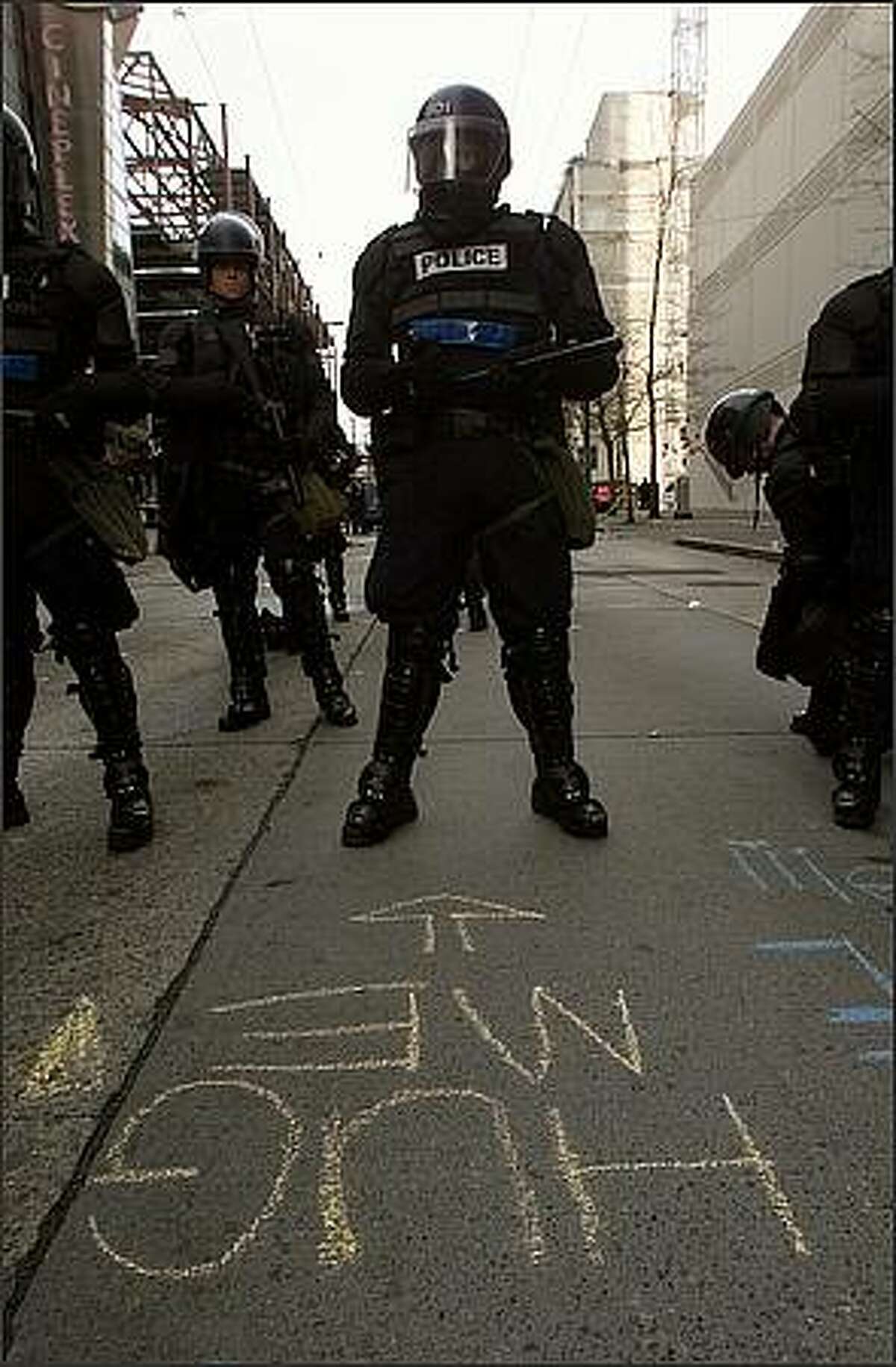 Chalk message for riot police. Photo by Mike Urban/Seattle Post-Intelligencer