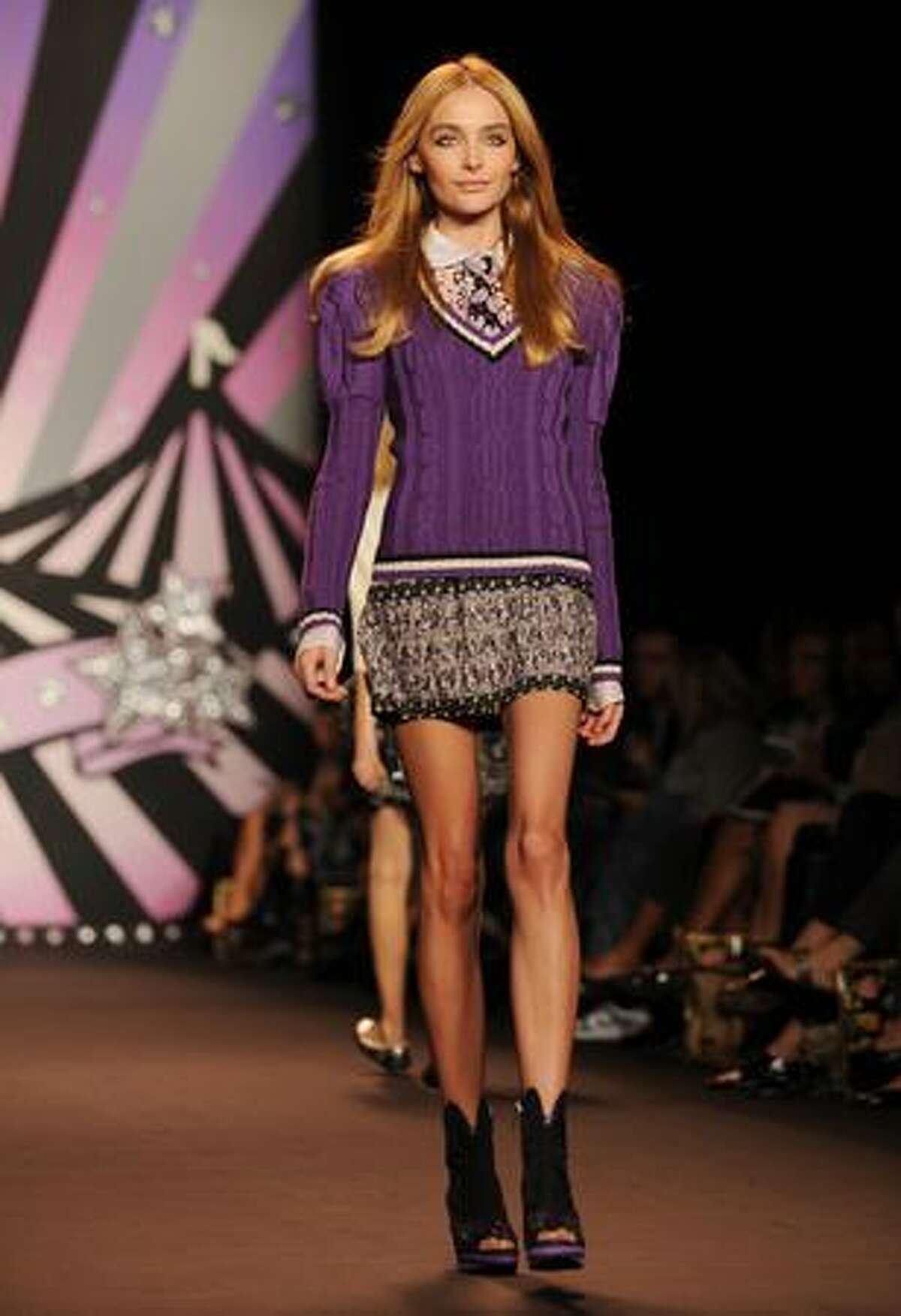 A model presents an outfit by Anna Sui.