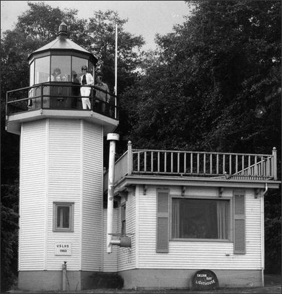 Skunk Bay Lighthouse is inspected by some of the new owners in September, 1970. (Seattle Post-Intelligencer)
