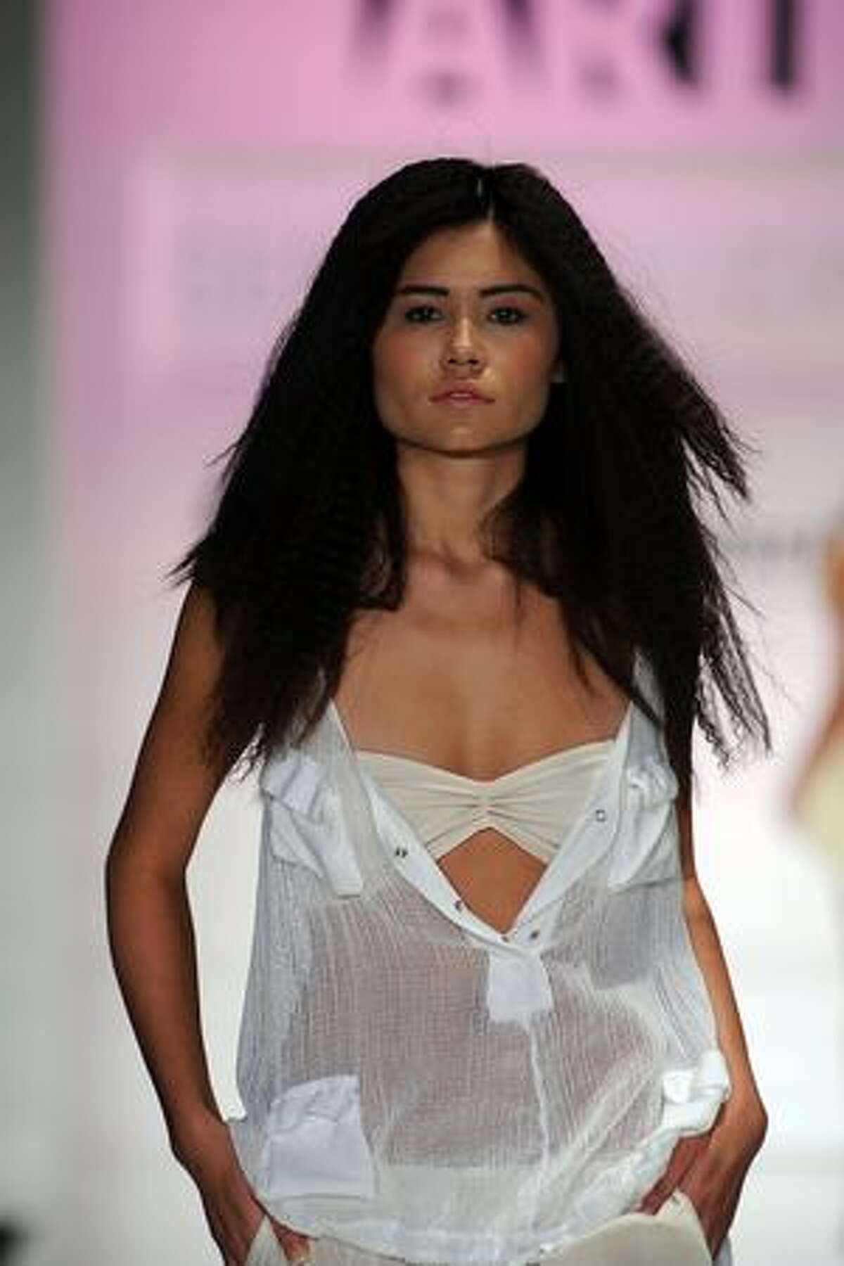 A model wears Seneca Rising on the runway at Gen Art's 12th Annual "Fresh Faces In Fashion" at the Petersen Automotive Museum in Los Angeles, California.
