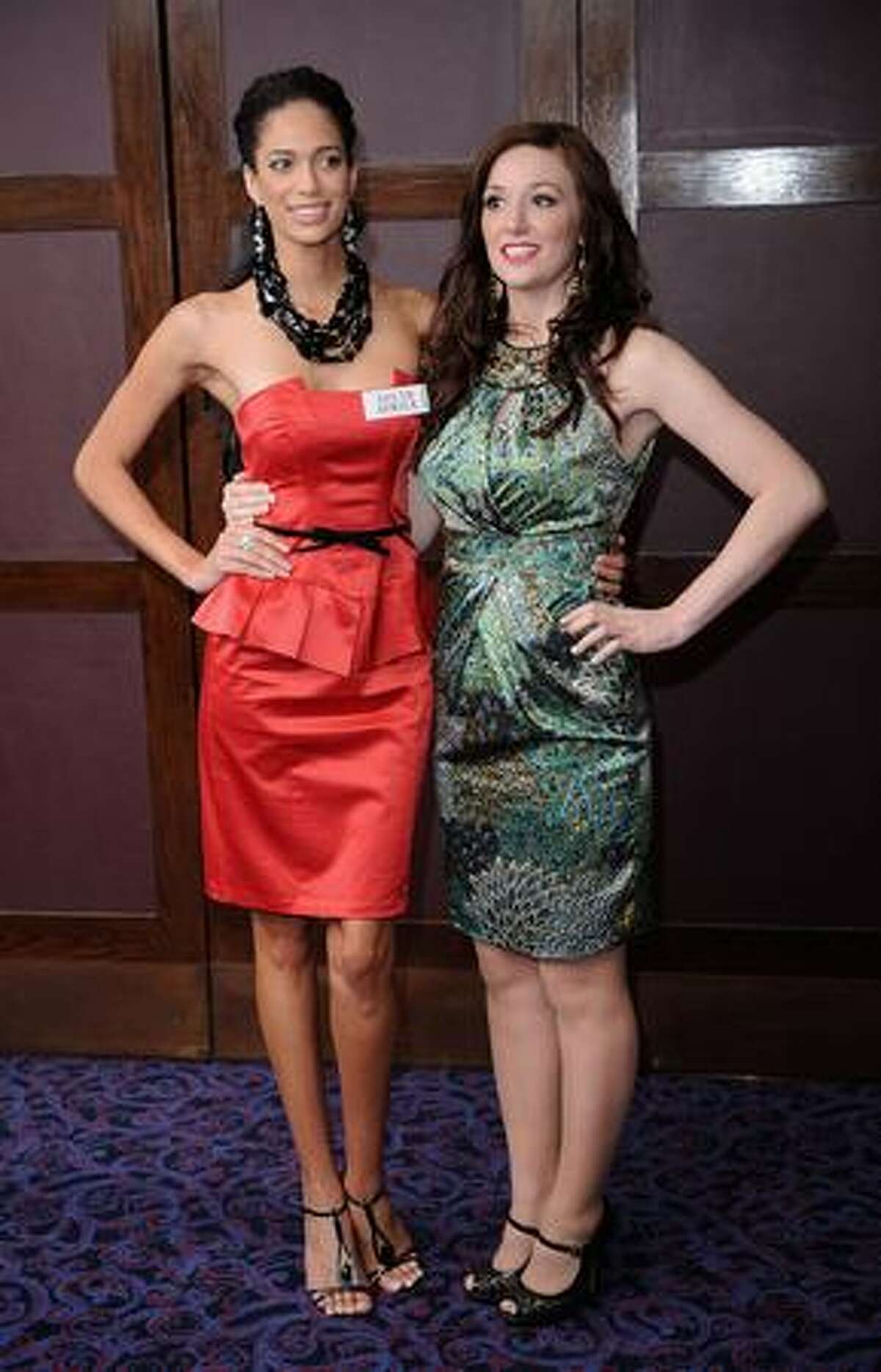 Tatum Keshwar, Miss South Africa, and Katrina Hodge, Miss England, attend the photocall.