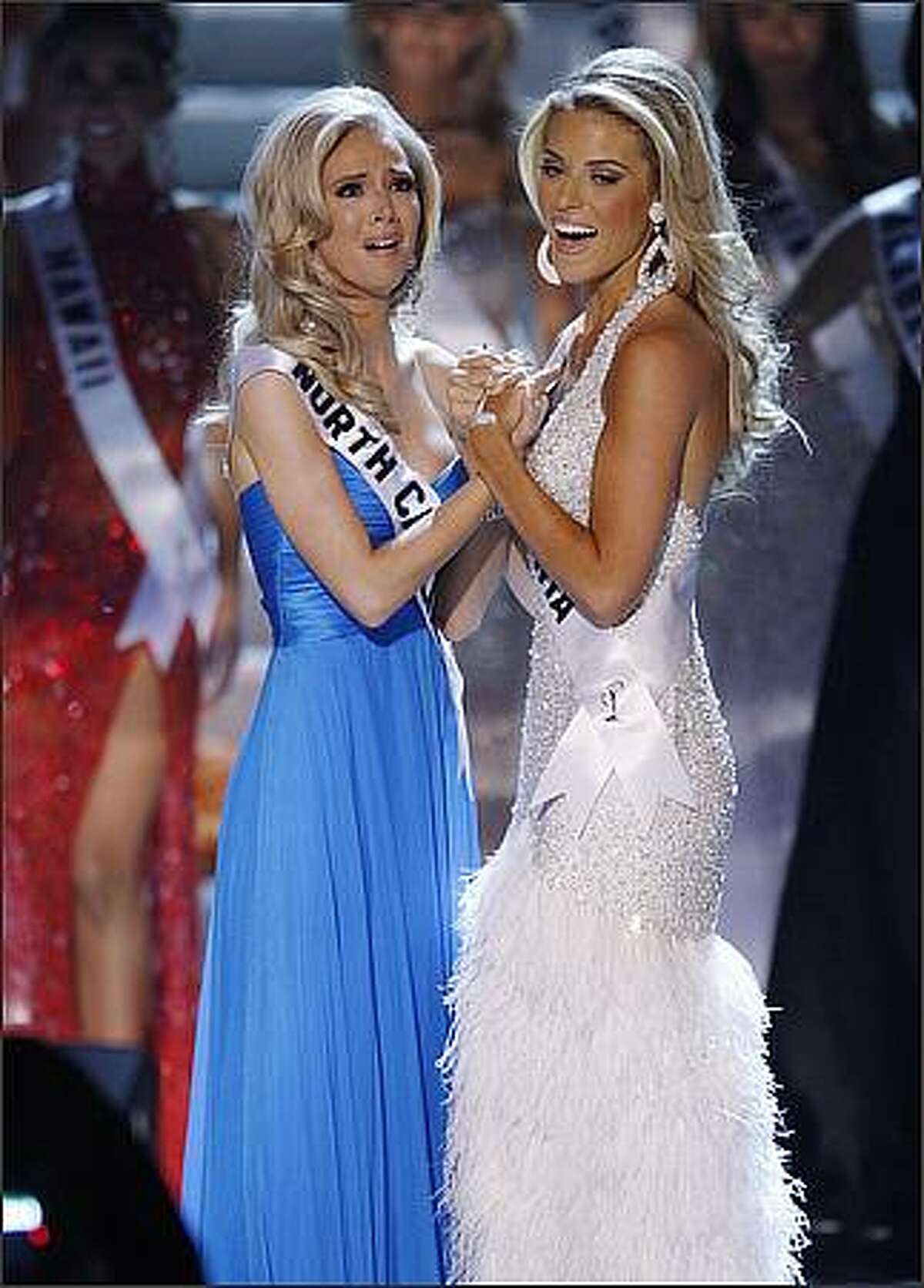 Miss North Carolina Kristen Dalton, left, and first runner-up Miss California Carrie Prejean, from San Diego, react after Dalton is announced Miss USA on Sunday in Las Vegas. (AP Photo/Eric Jamison)