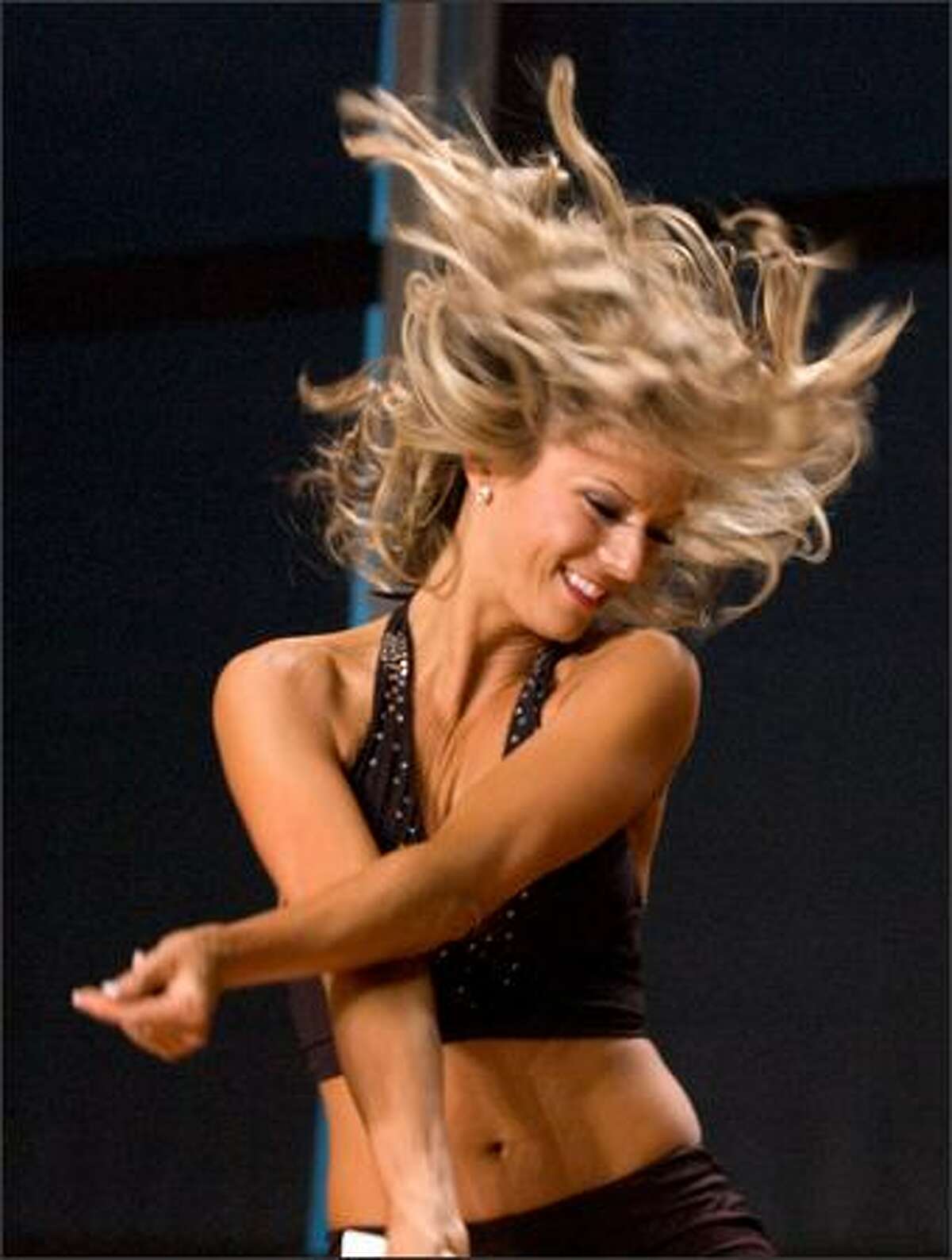 A participant competes during final tryouts for the Sea Gals at Qwest Field Sunday. (Daniel Berman / Special to SeattlePI.com)