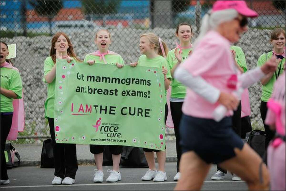 Cheerleaders encourage runners at the start of the 2009 Komen Puget Sound Race for the Cure at Qwest Field in Seattle on Sunday.