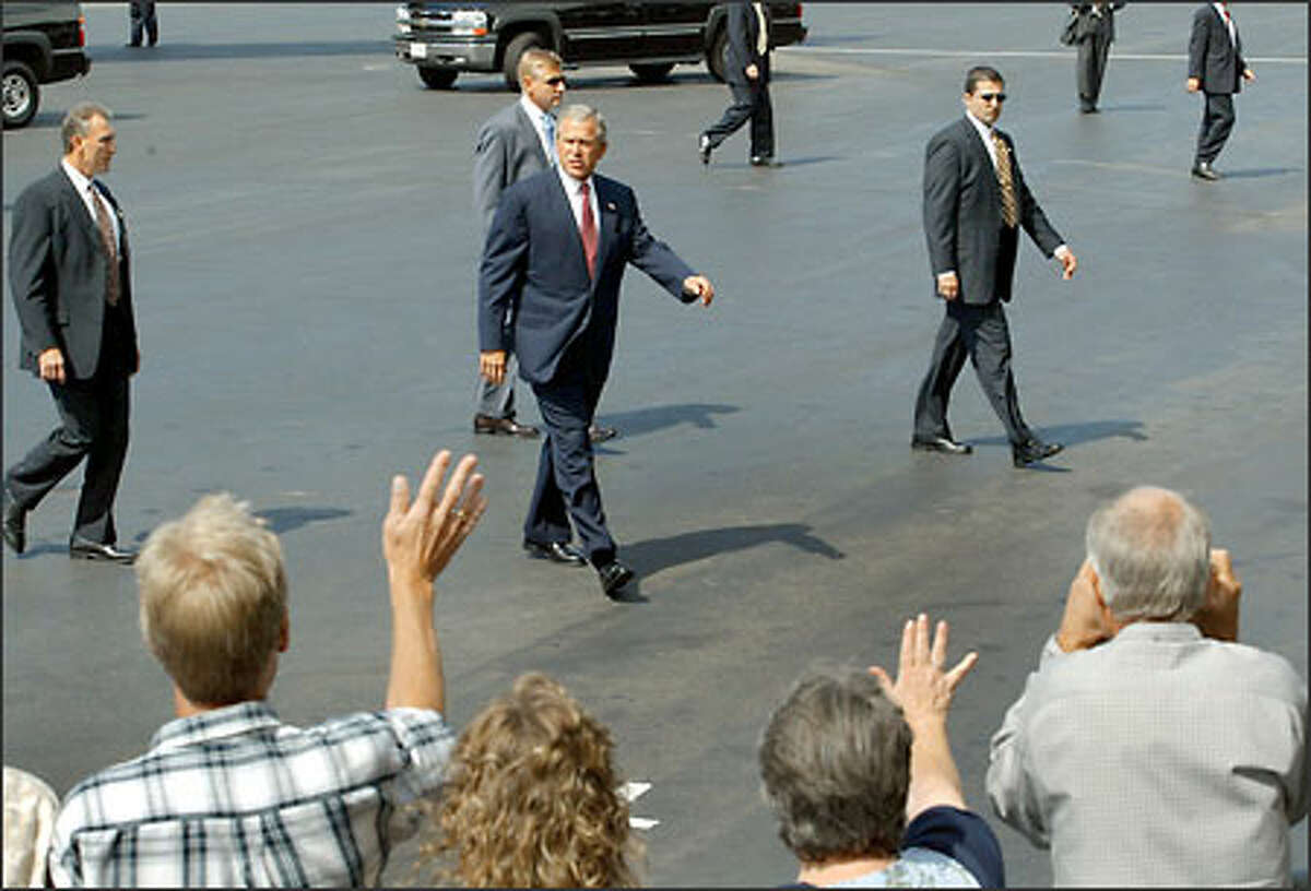 A select group of supporters greets President Bush as he arrives at Boeing Field at noon.