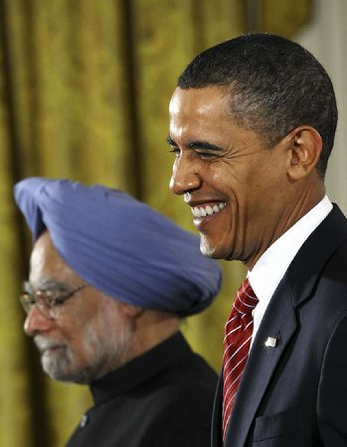Indian Prime Minister Manmohan Singh and U.S. President Barack Obama participate in a joint press conference in the East Room of the White House.