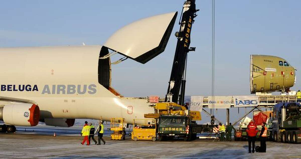 The cockpit of an Airbus A400M military transport airplane is unloaded from an Airbus A300-600 ST "Beluga" at the airport in the eastern German city of Dresden on Jan. 5, 2010.