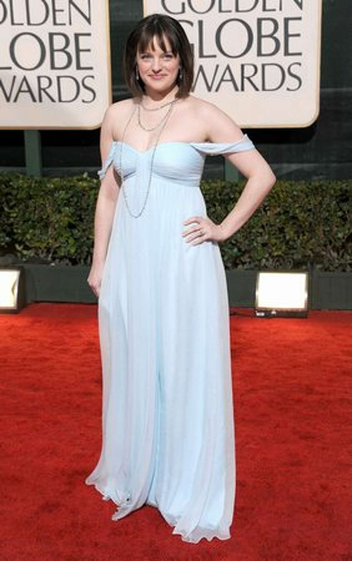 We love Elisabeth Moss as Peggy on "Mad Men" but even she might know better than to wear this gown which does not compliment her body and makes her look dumpy and washed-out.