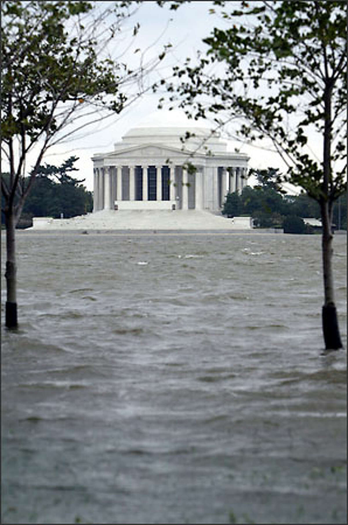 The overflowing Tidal Basin, across from the Jefferson Memorial, in Washington, D.C., in the aftermath of Hurricane Isabel. Thousands of residents were without lights, hundreds of trees littered the landscape, and all three branches of government were basically shut down. (AP Photo/Evan Vucci)