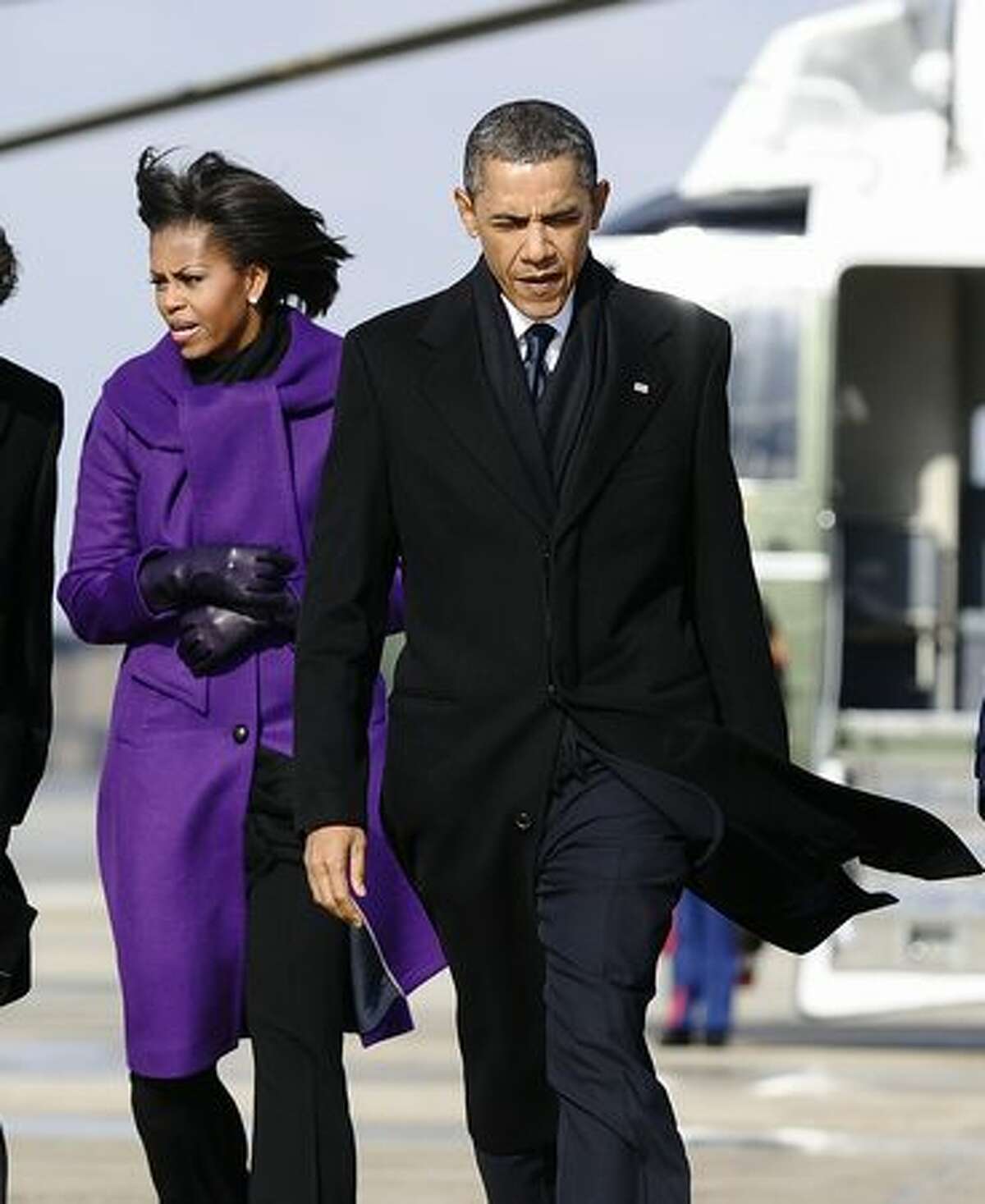 US President Barack Obama and First Lady Michelle Obama arrive to board Air Force One at the Andrews Air Force Base in Maryland on Wednesday to leave for Tucson, Arizona, to attend the memorial event “Together We Thrive: Tucson and America” to support and remember victims of the mass shooting in Tucson. The First Couple will attend tribute service for the six people who were killed and the 14 wounded in the assassination attempt on congresswoman Gabrielle Giffords, who is fighting for her life in a hospital.