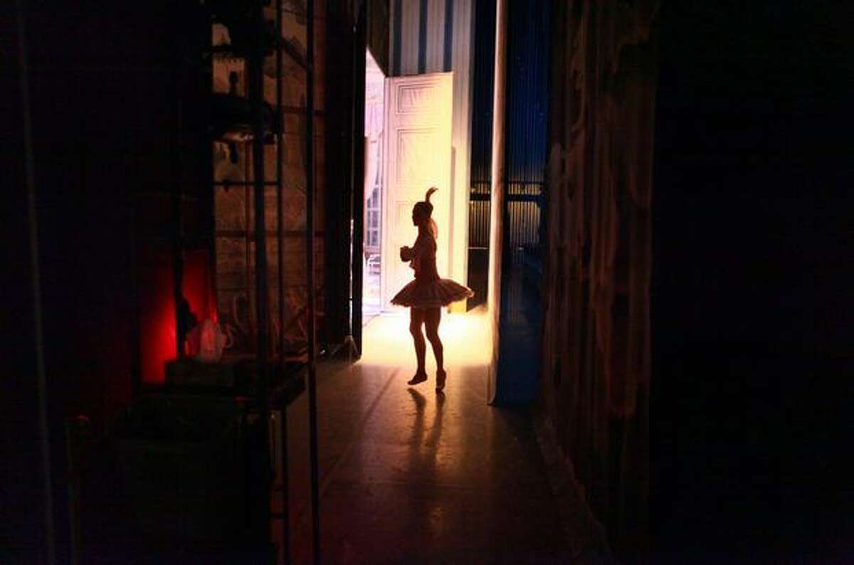 A dancer prepares backstage.
