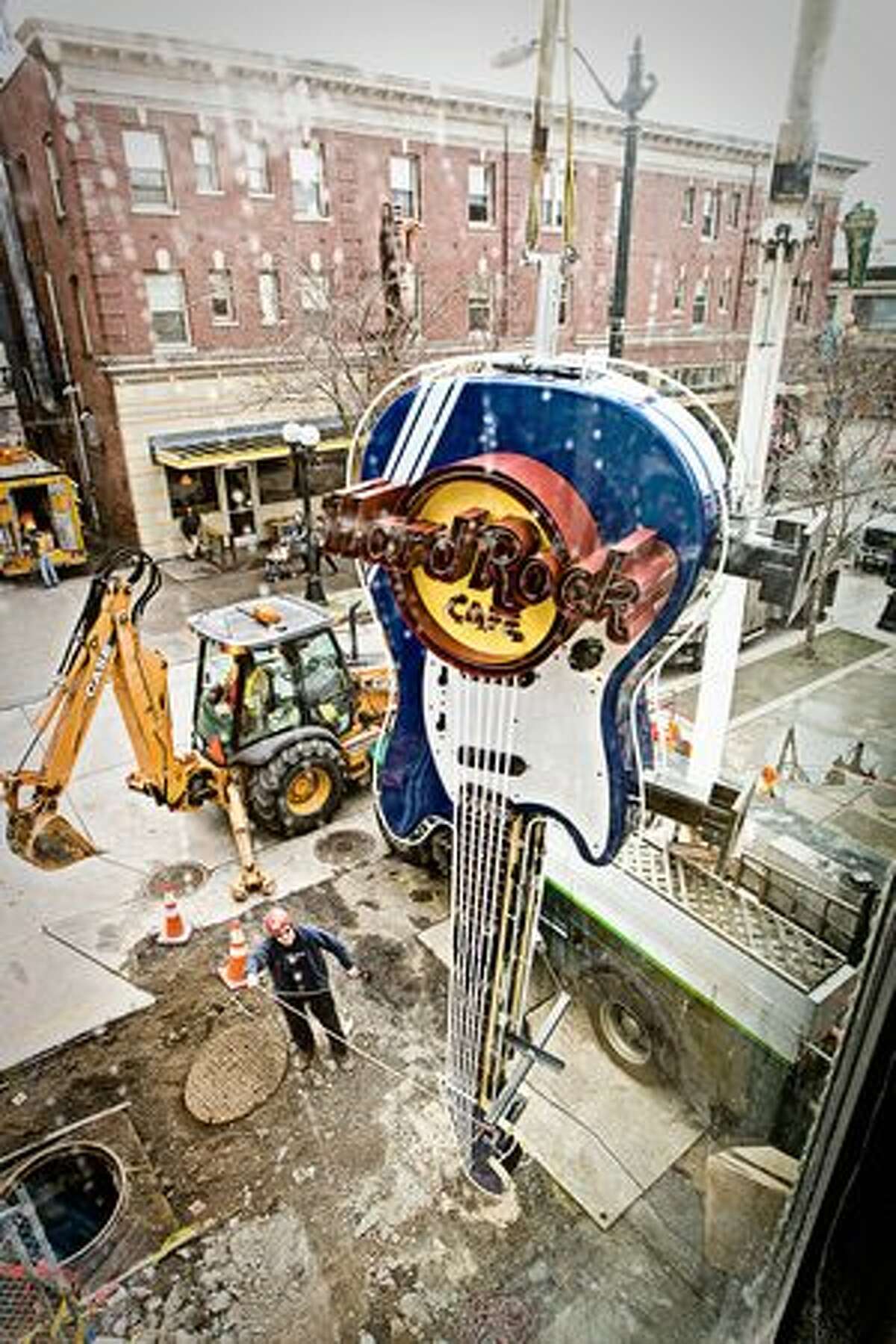 Crews install a model Fender Mustang guitar at 116 Pike St., the site of Seattle's new Hard Rock Cafe. (Photo by Mat Hayward for Hard Rock Cafe Seattle)
