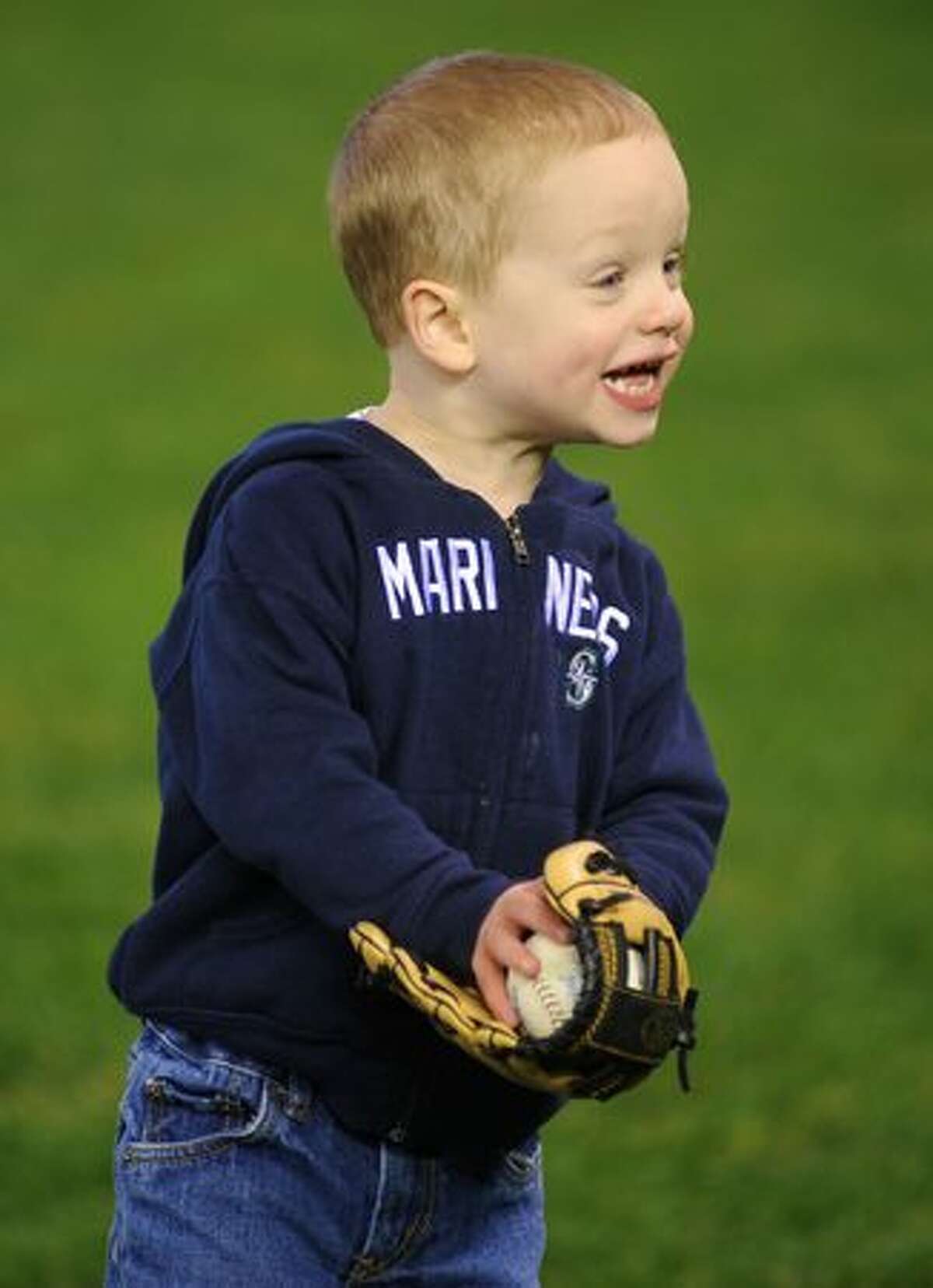 Dylan Clementz, 2, reacts to catching a ball.