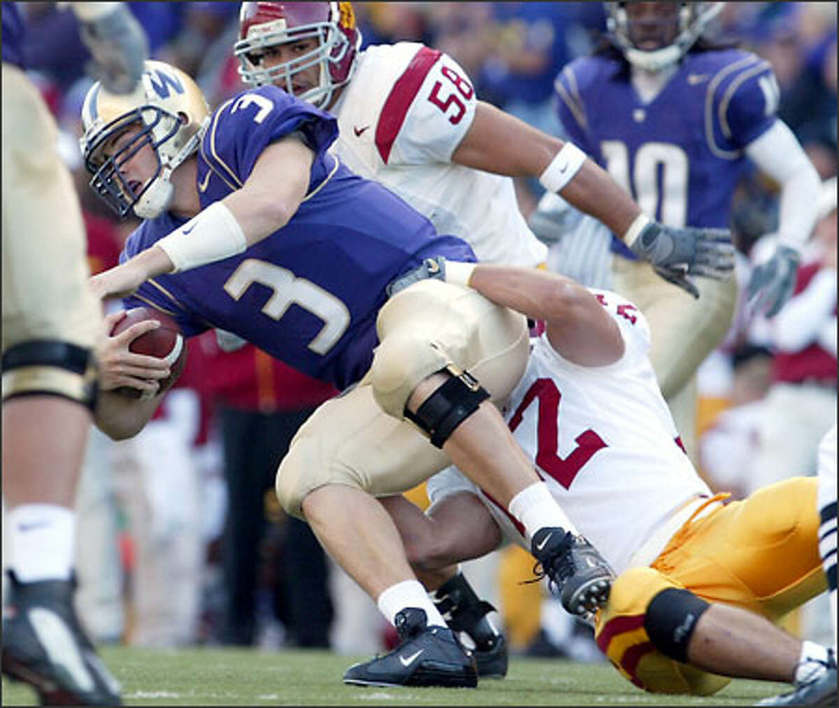 UW's Cody Pickett gets tackled in the first quarter.