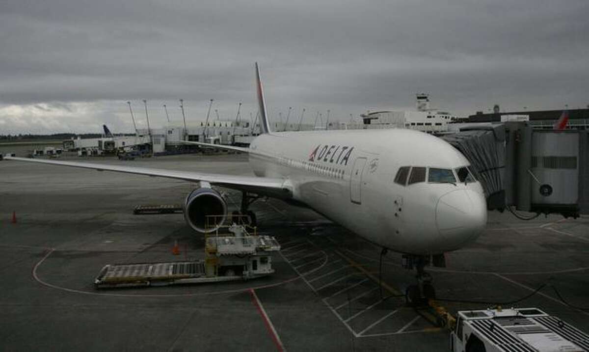 A Delta Air Lines Boeing 767-300ER waits at the gate at SeaTac Airport for carrier's first scheduled nonstop flight from Seattle to Osaka, Japan.