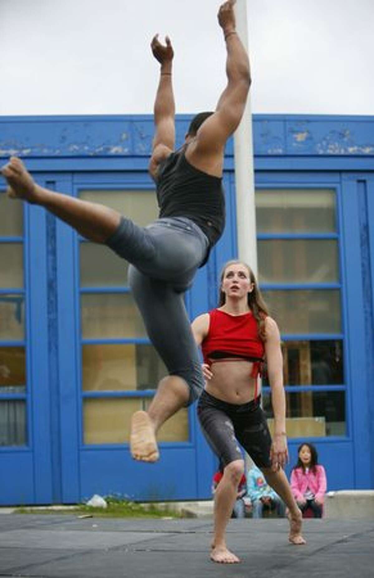 Dancer Isaiah Sumler leaps toward Christina Cooley during a performance by DASSdance during a Juneteenth community celebration hosted by the Atlantic Street Center at the Rainier Beach Community Center on Thursday June 17, 2010. Juneteenth is a holiday that commemorates African American freedom from slavery, while emphasizing education and achievement. This is the 10th year the Atlantic Street Center has hosted the celebration in Seattle.