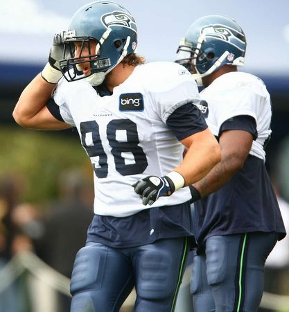 Seattle Seahawk Nick Reed practices with teammates during training camp.