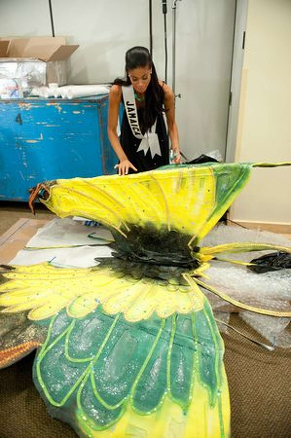 Yendi Phillipps, Miss Jamaica 2010, gets her costume ready backstage.
