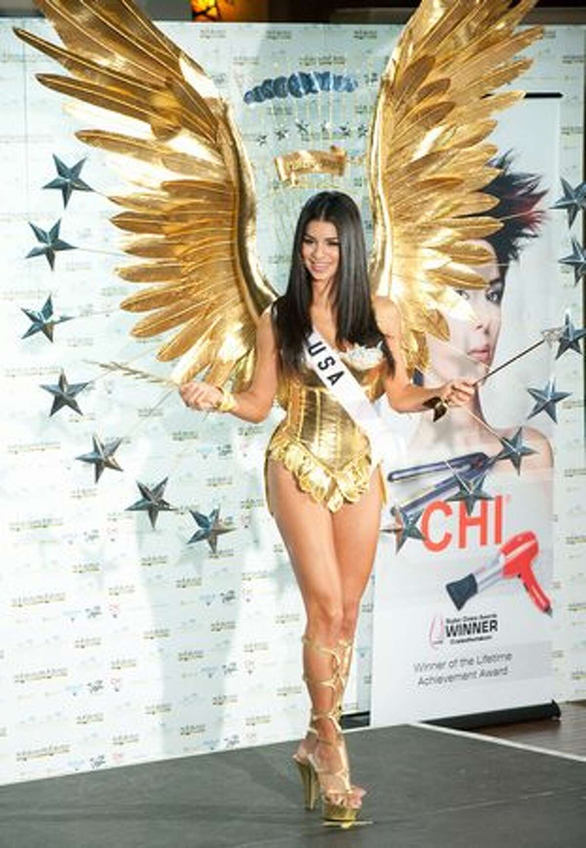 Rima Fakih, Miss USA 2010, in a creation inspired by the bald eagle and the presidential seal.