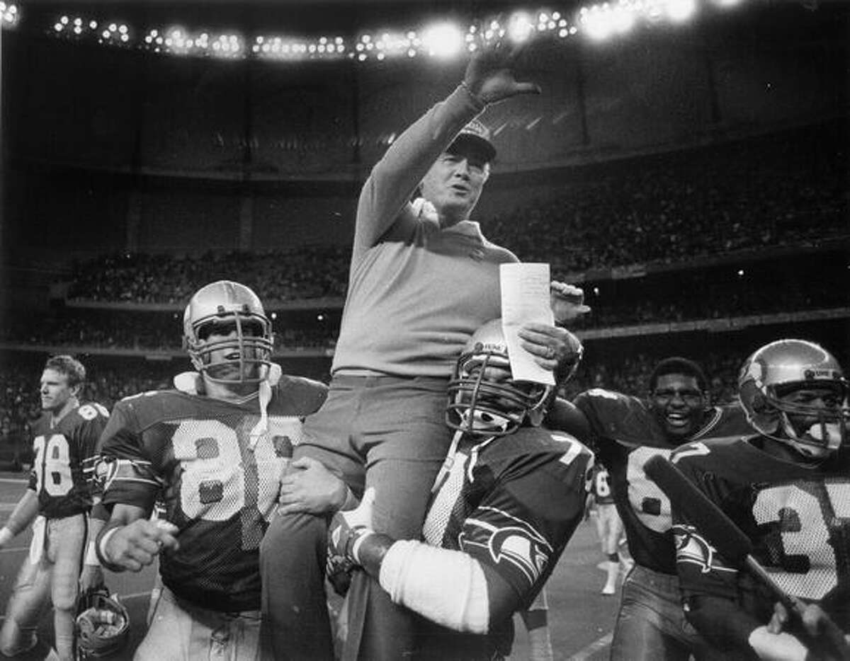 Chuck Knox is carried off the Kingdome field after a win that sent the Seahawks to the 1983 playoffs.