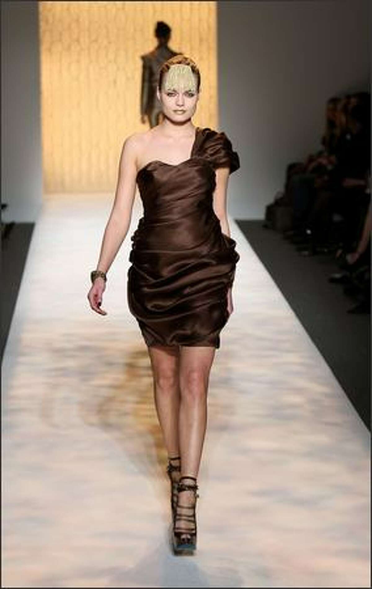 A model walks the runway during the Christian Siriano Fall 2009 fashion show at Mercedes-Benz Fashion Week in New York, Thursday, Feb. 19, 2009.