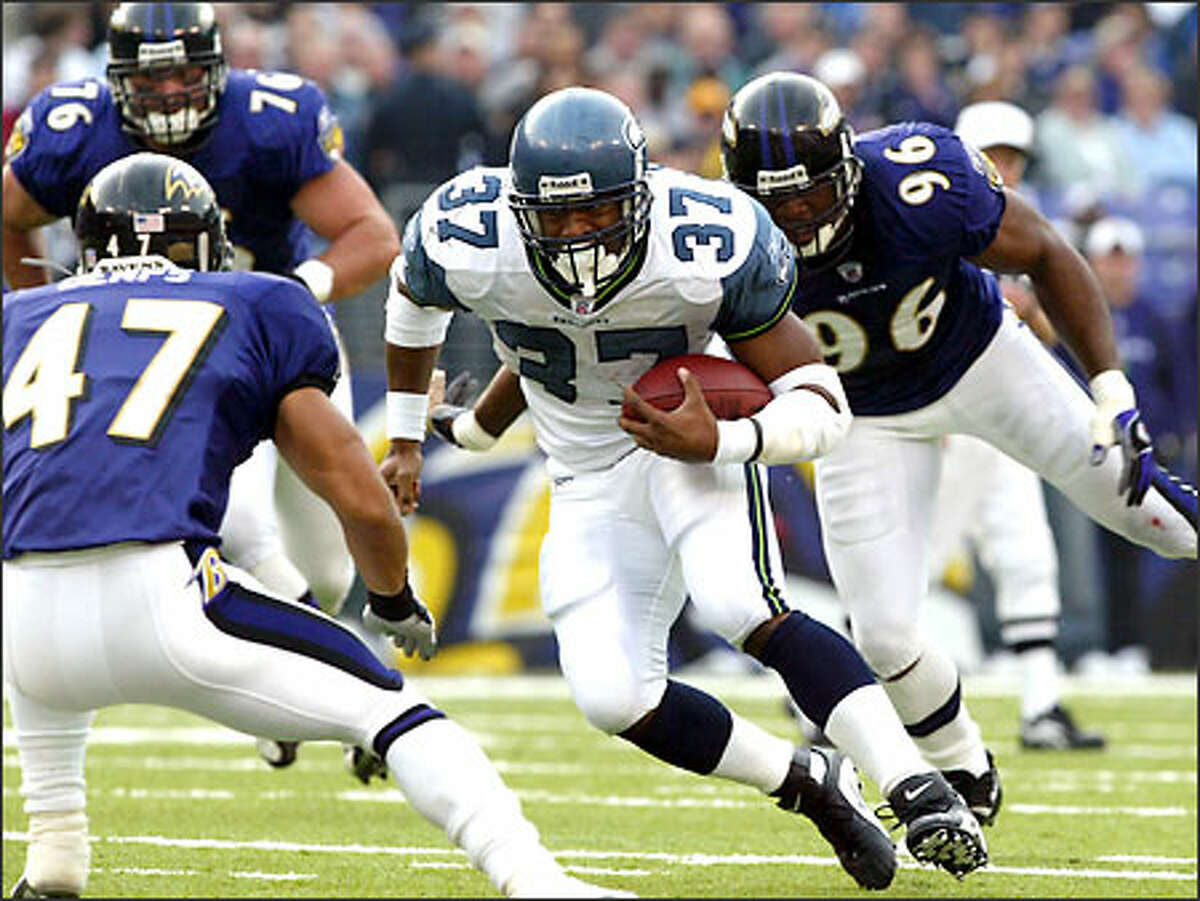 Seahawks running back Shawn Alexander rushes for 6 of his 72 yards on 22 carries against the Ravens.