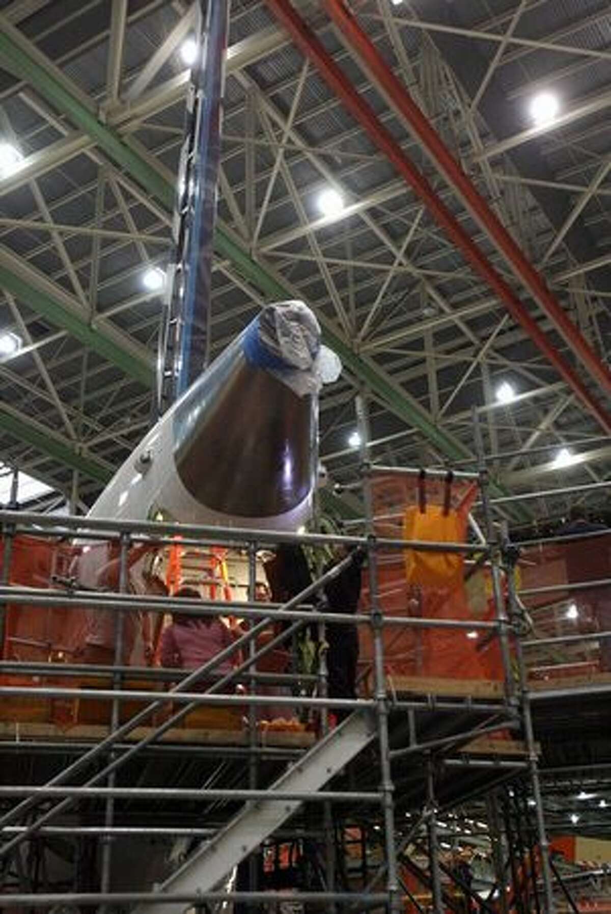 Boeing workers work on a 787 Dreamliner for launch customer All Nippon Airways at the company's wide-body plant in Everett, Wash.