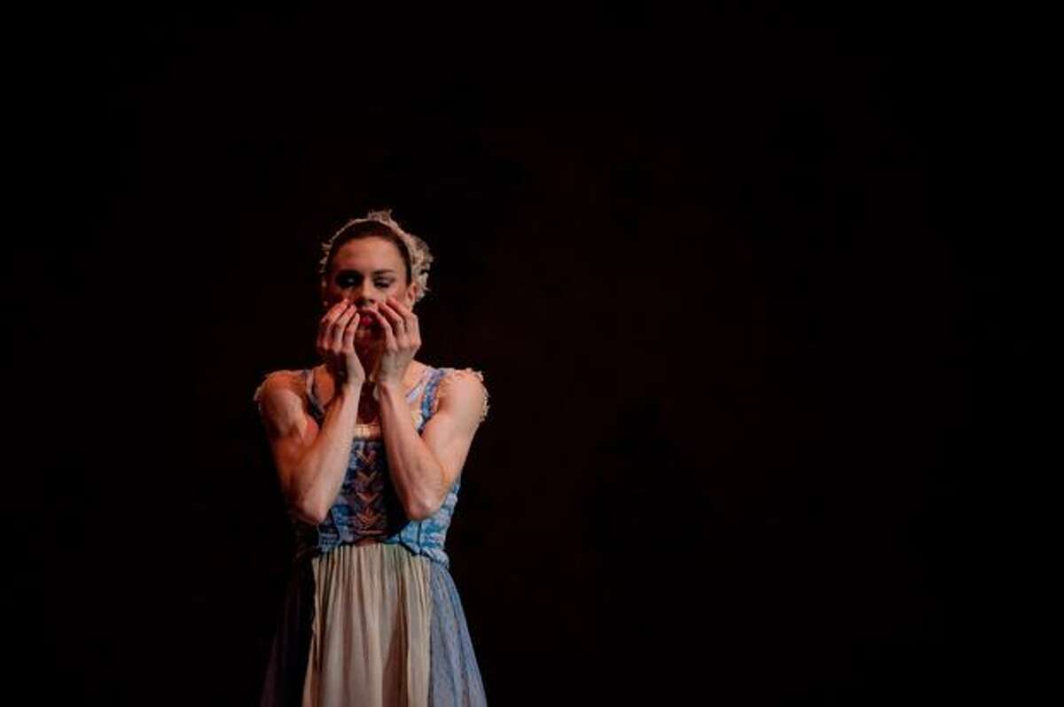 Rachel Foster, playing Cinderella, covers her face after the family leaves for the ball.