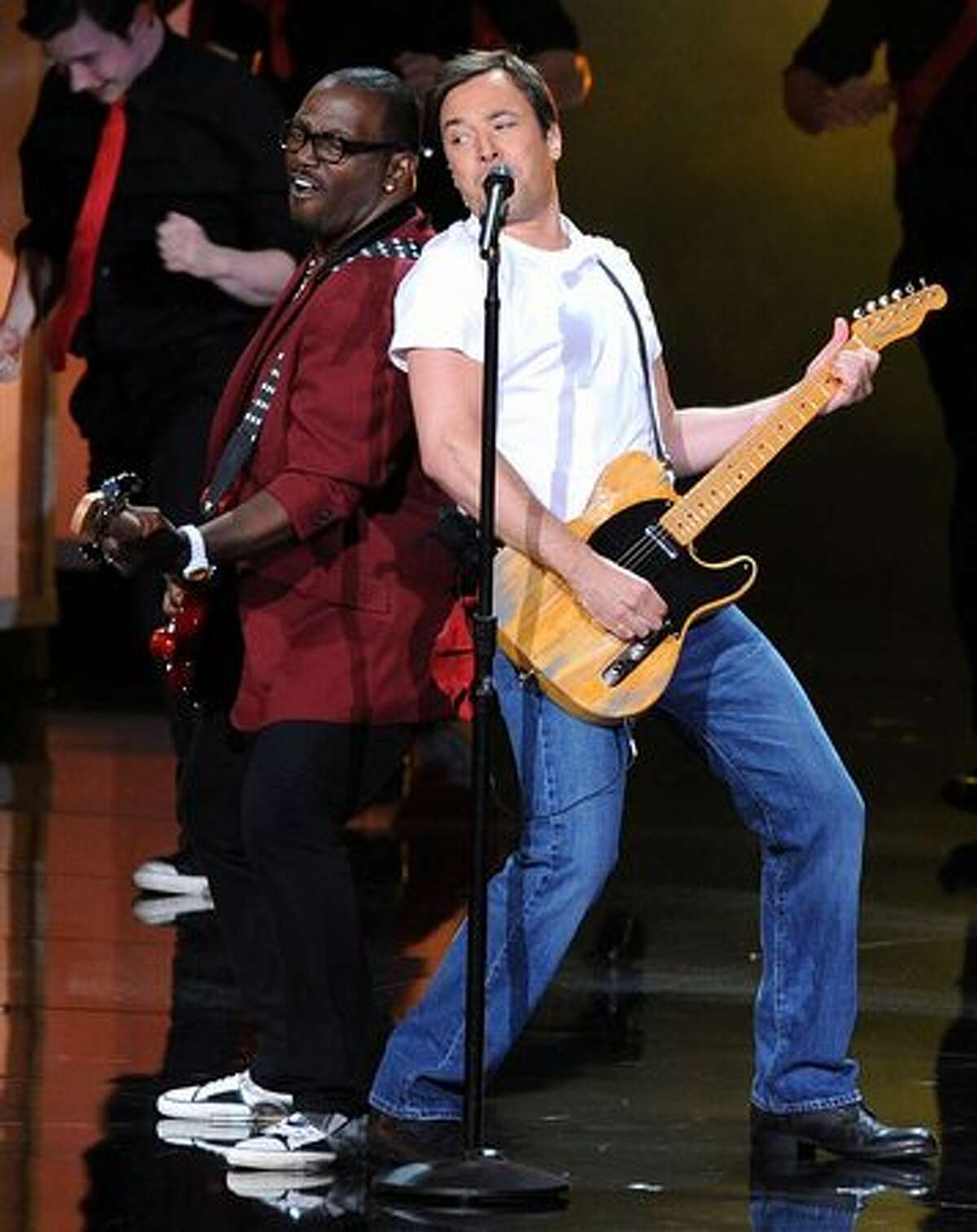 Musician Randy Jackson (L) and host Jimmy Fallon perform onstage.