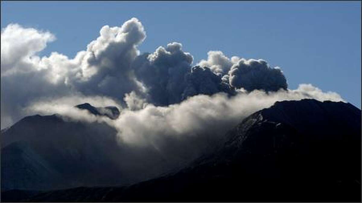 Mount St. Helens erupts at approximately 9:40 a.m. Monday as seen from the Coldwater Ridge Visitor Center.
